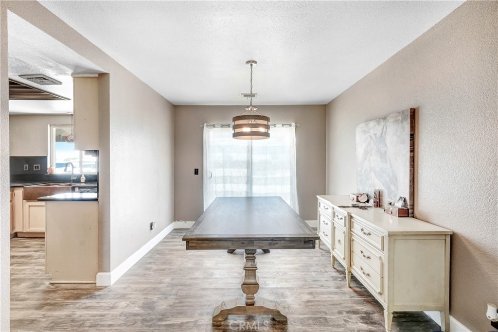 15395 Apache Road Apple Valley, CA 92307 - Photo 6 of 20 a very nice looking dining room with a window and a kitchen