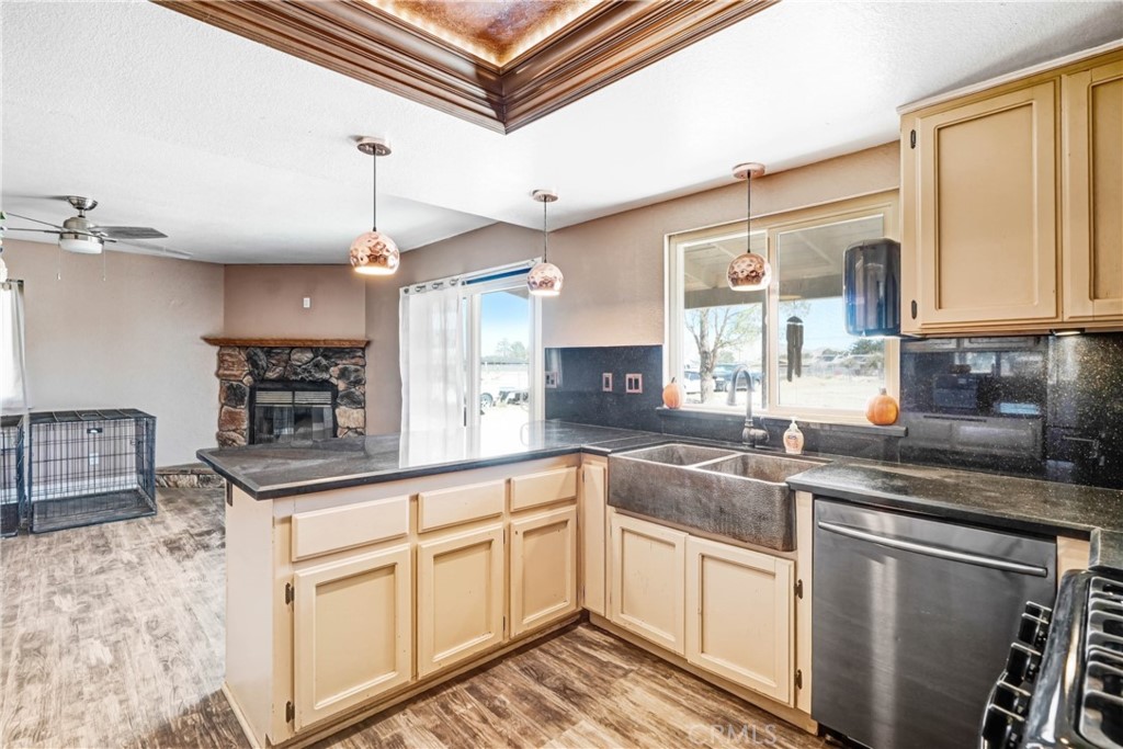 15395 Apache Road Apple Valley, CA 92307 - Photo 7 of 20 a kitchen with granite countertop a sink stainless steel appliances and cabinets