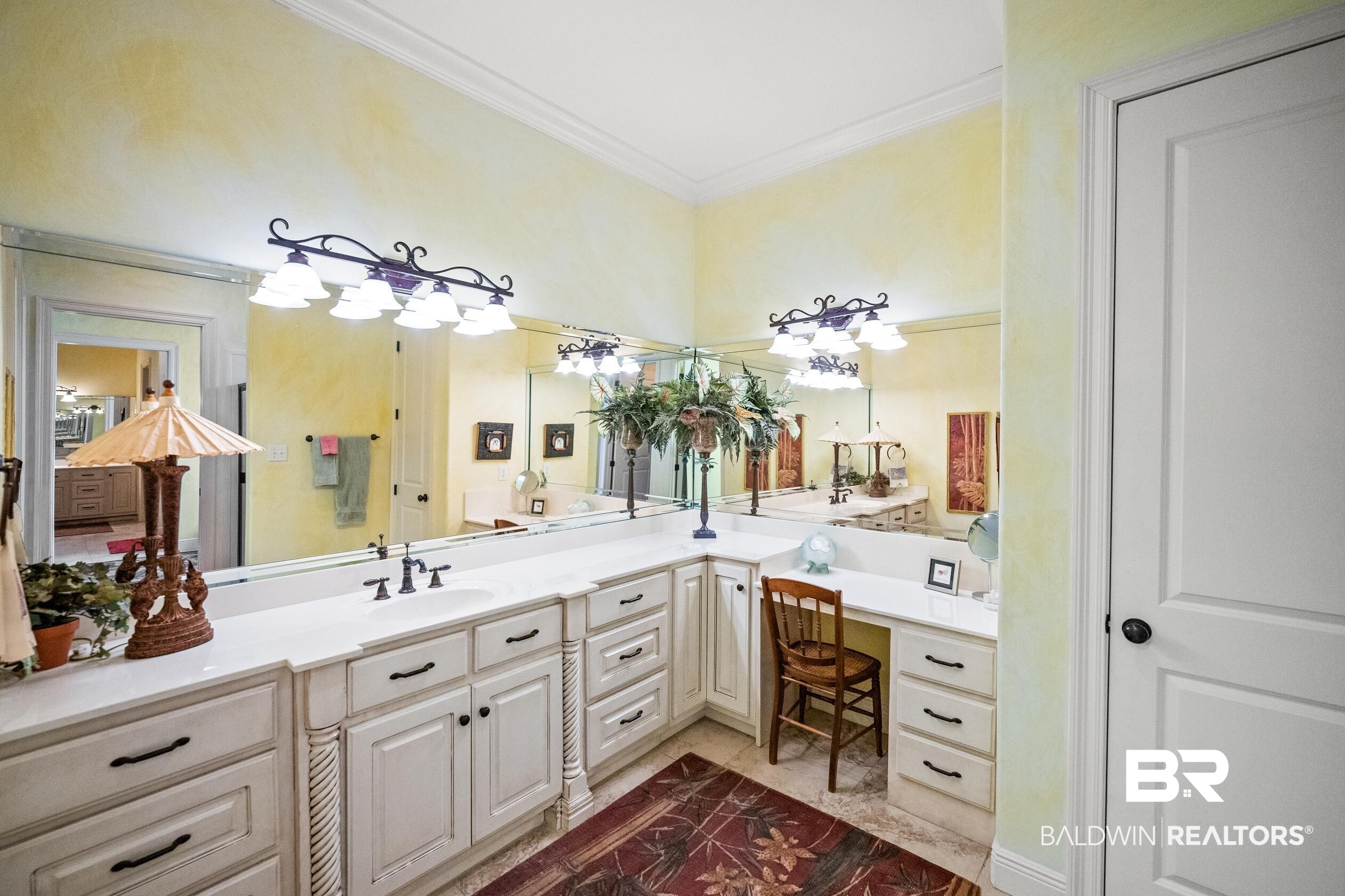 404 Peninsula Boulevard Gulf Shores, AL 36542 - Photo 17 of 51 Bathroom with vanity and crown molding