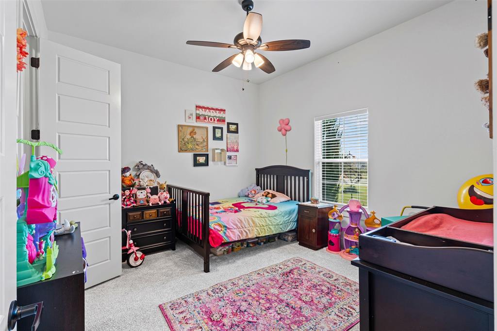2045 Ellis Ridge Drive Weatherford, TX 76087 - Photo 21 of 40 Bedroom featuring light carpet and a ceiling fan