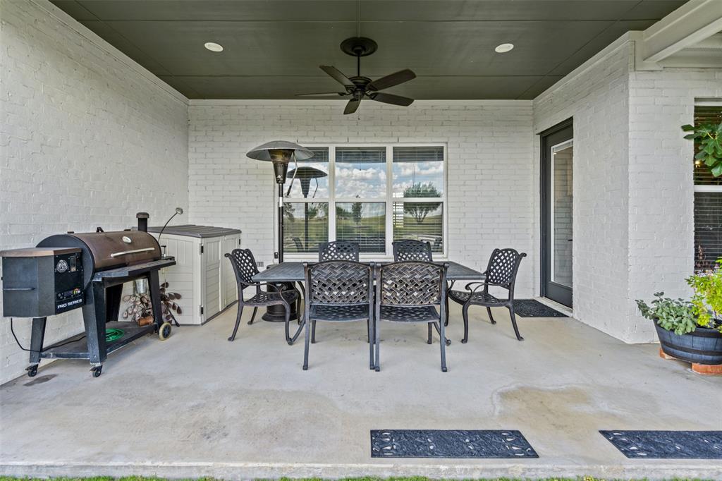 2045 Ellis Ridge Drive Weatherford, TX 76087 - Photo 29 of 40 View of patio / terrace with outdoor dining area, area for grilling, and a ceiling fan
