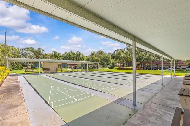 a view of an swimming pool with outdoor seating