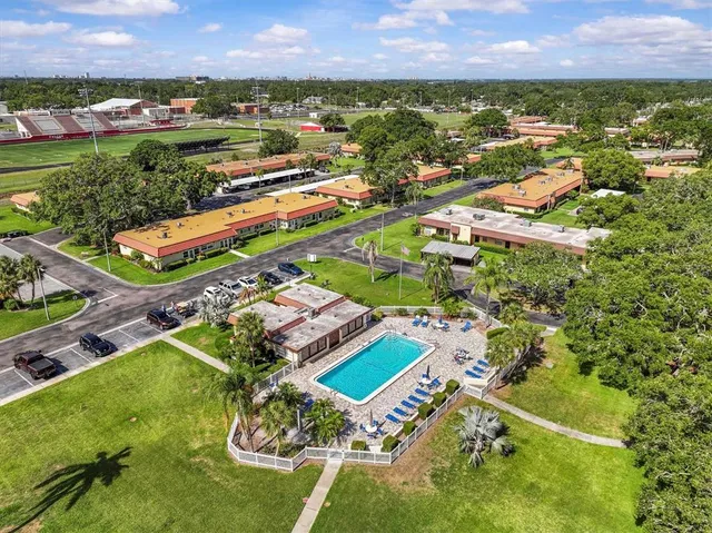 an aerial view of residential houses with outdoor space