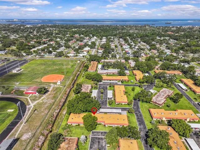 an aerial view of residential houses with outdoor space
