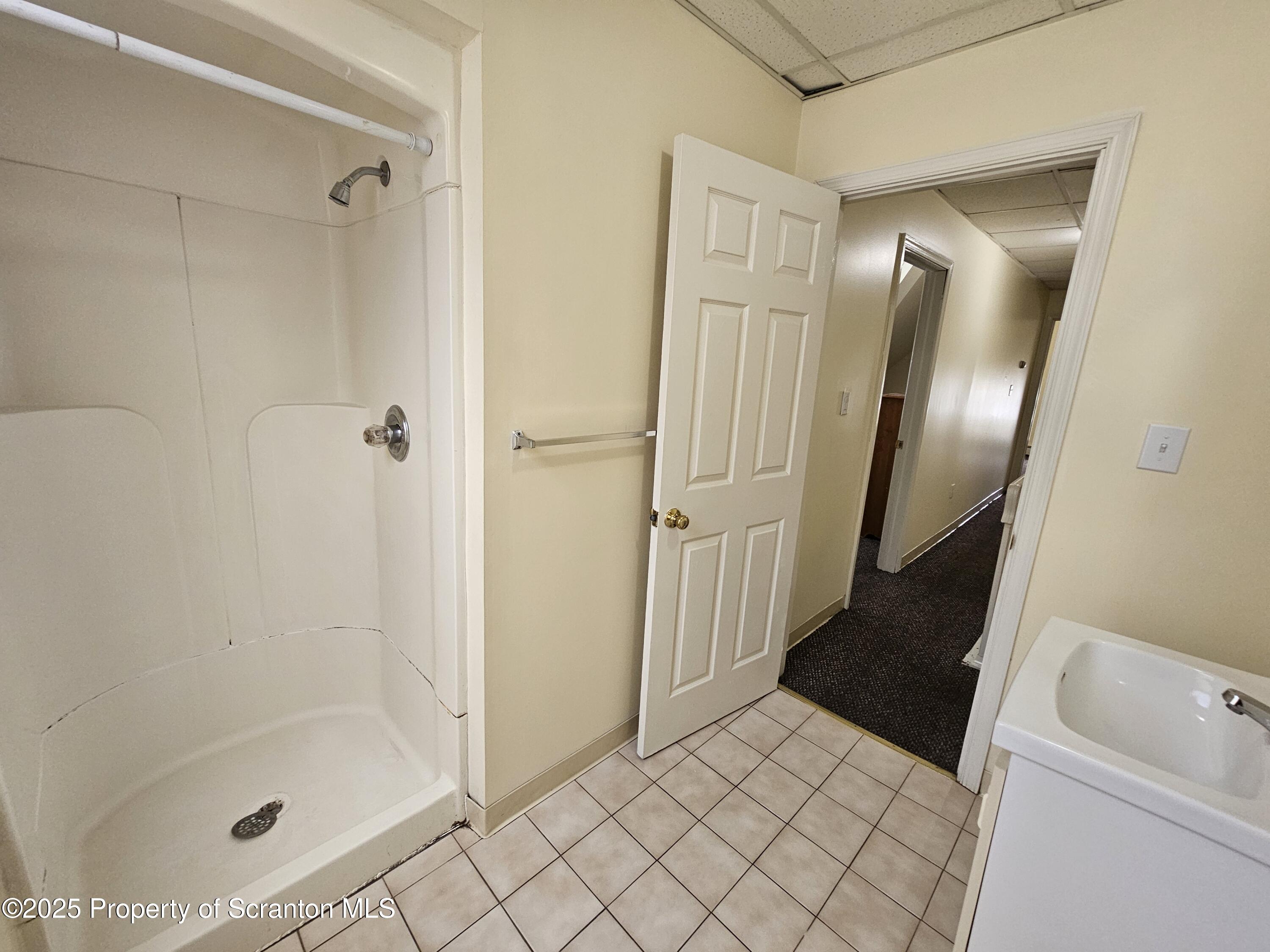 1207 Mulberry Street Scranton, PA 18510 - Photo 15 of 21 a bathroom with a tub and shower