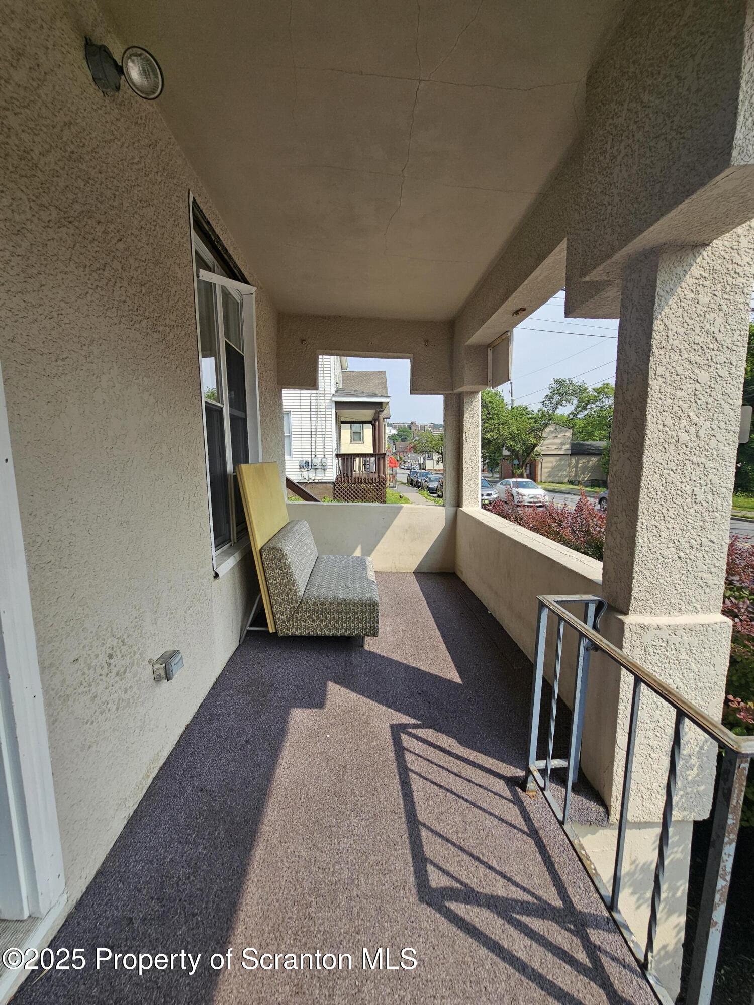 1207 Mulberry Street Scranton, PA 18510 - Photo 2 of 21 a living room with furniture and a floor to ceiling window