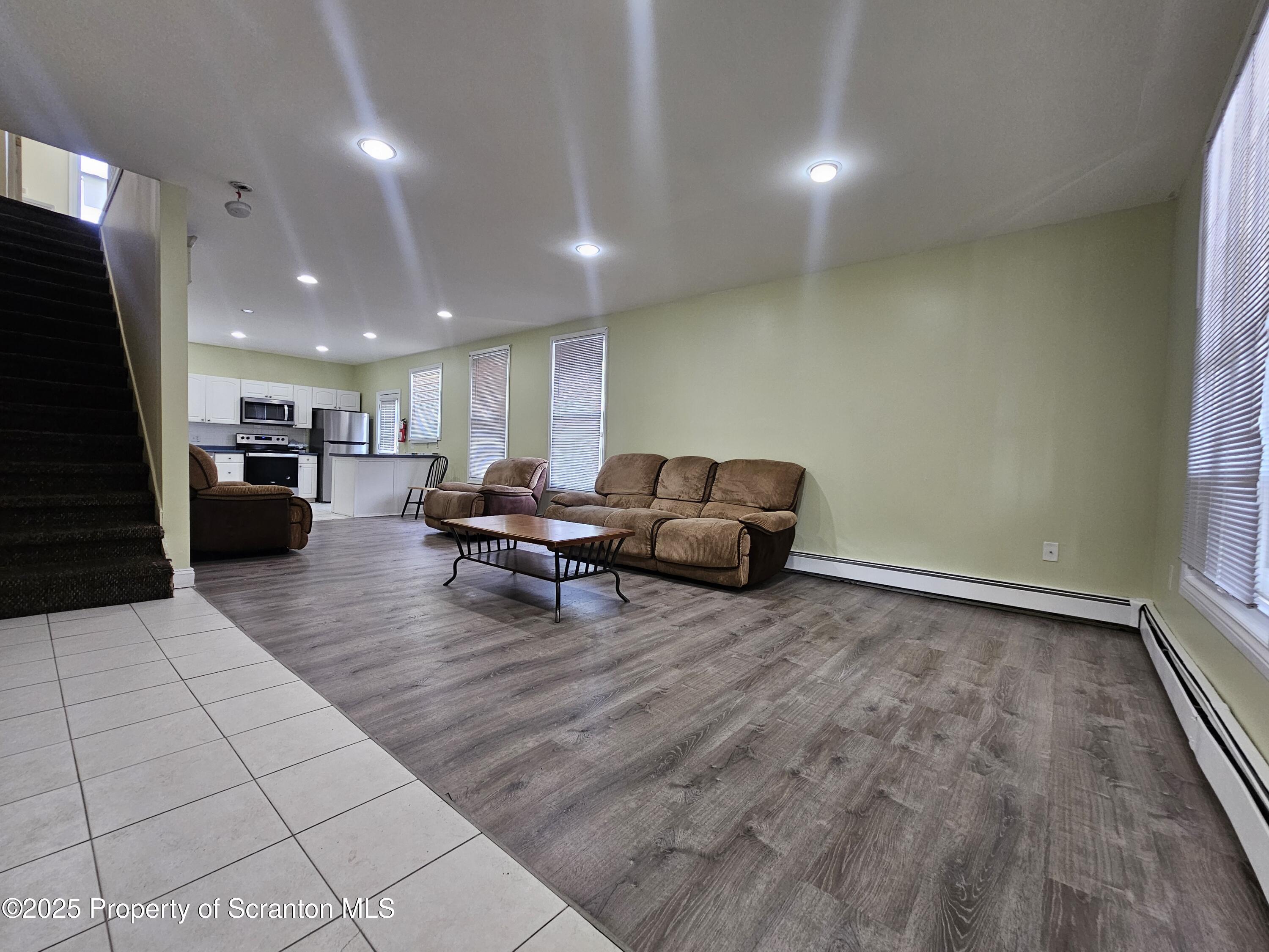1207 Mulberry Street Scranton, PA 18510 - Photo 6 of 21 a living room with furniture and a flat screen tv