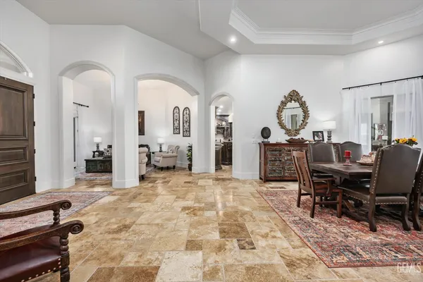 a view of a dining room with furniture and a yard