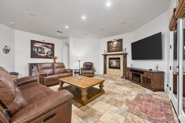 a kitchen with stainless steel appliances granite countertop a sink a stove top oven a counter space and cabinets