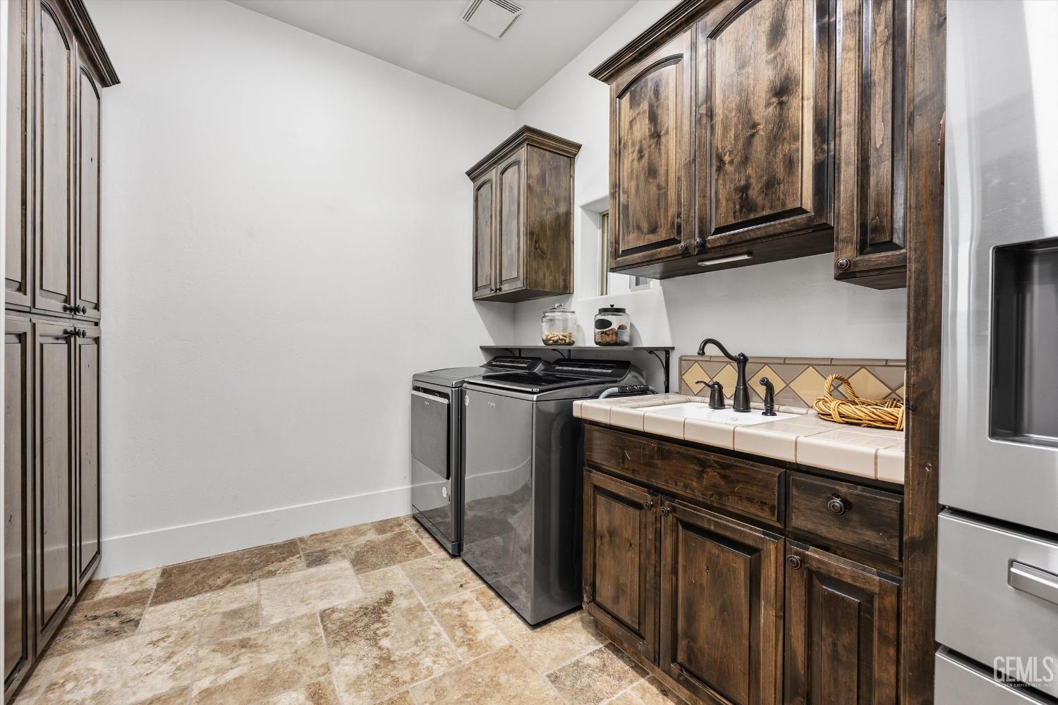 Undisclosed Address Bakersfield, CA 93314 - Photo 20 of 59 a kitchen with stainless steel appliances granite countertop a sink stove and refrigerator
