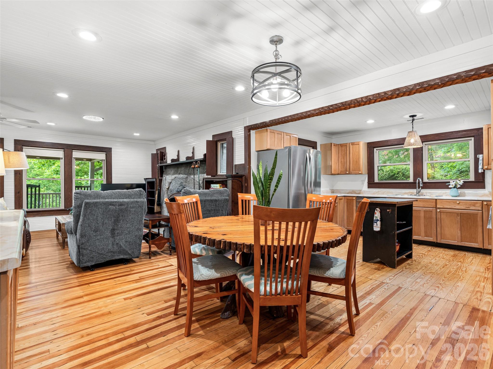 206 Chestnut Hill Road Gerton, NC 28735 - Photo 14 of 48 a view of a dining room with furniture window and wooden floor