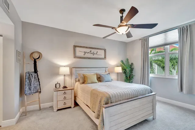 a kitchen with stainless steel appliances granite countertop a refrigerator and a stove