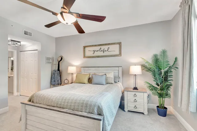 a bed room with a bed window and a dresser