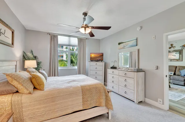 a bathroom with a double vanity sink mirror and toilet