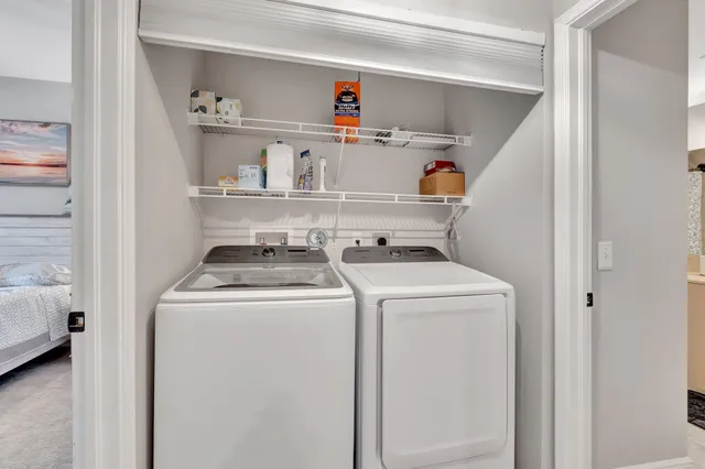 a room with lots of wooden furniture and a kitchen view