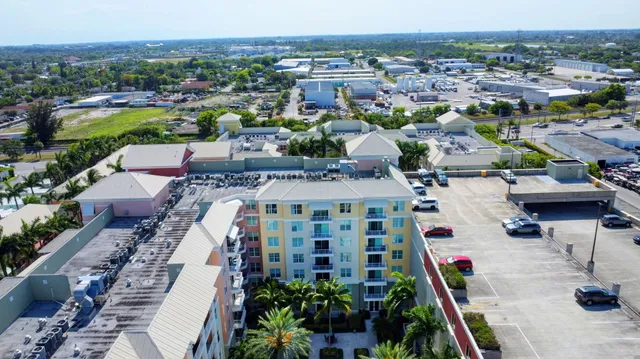 a view of a lobby with chair and flower vase