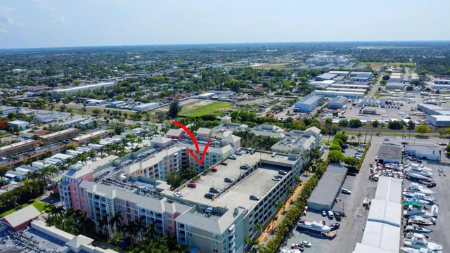 a balcony with furniture and a potted plant