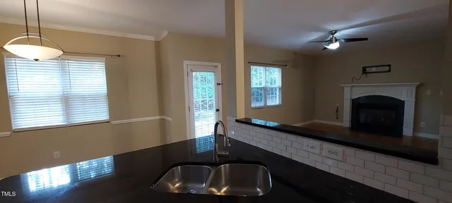 a kitchen with a sink and a window