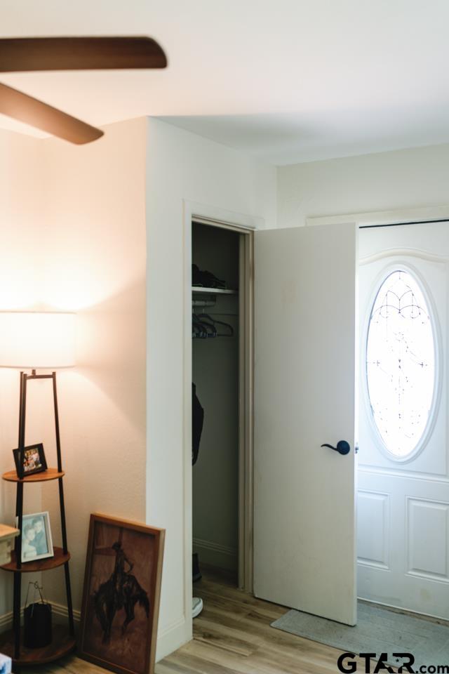 2411 Rodge Drive Tyler, TX 75701 - Photo 12 of 42 a view of a hallway with wooden floor and a bathroom view