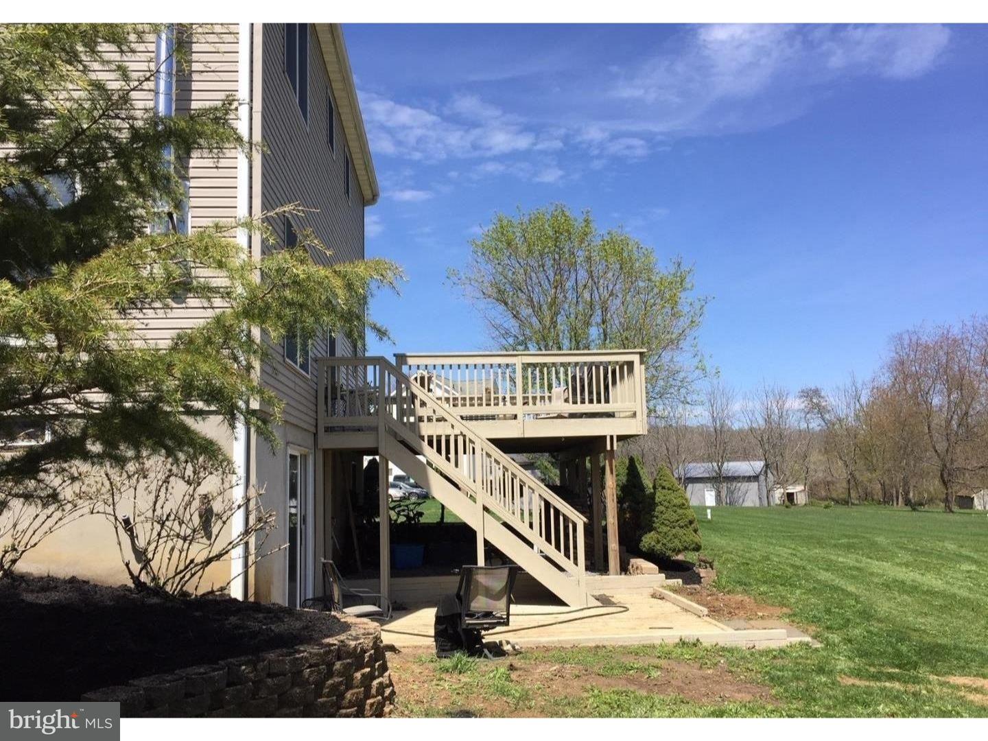 529 Province Line Road Allentown, NJ 08501 - Photo 20 of 21 a view of a house with a wooden deck