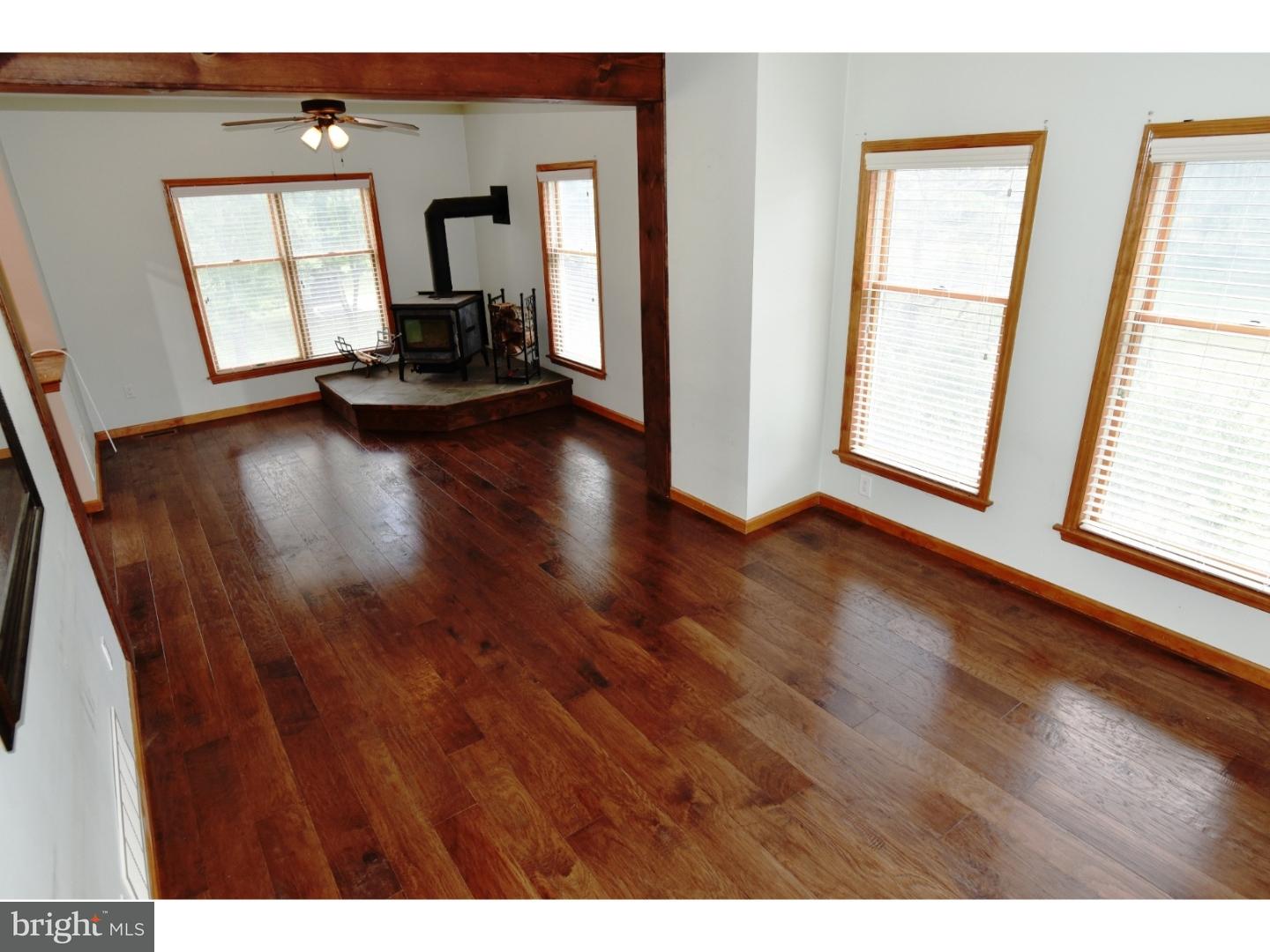 529 Province Line Road Allentown, NJ 08501 - Photo 6 of 21 a view of an empty room with wooden floor and a window
