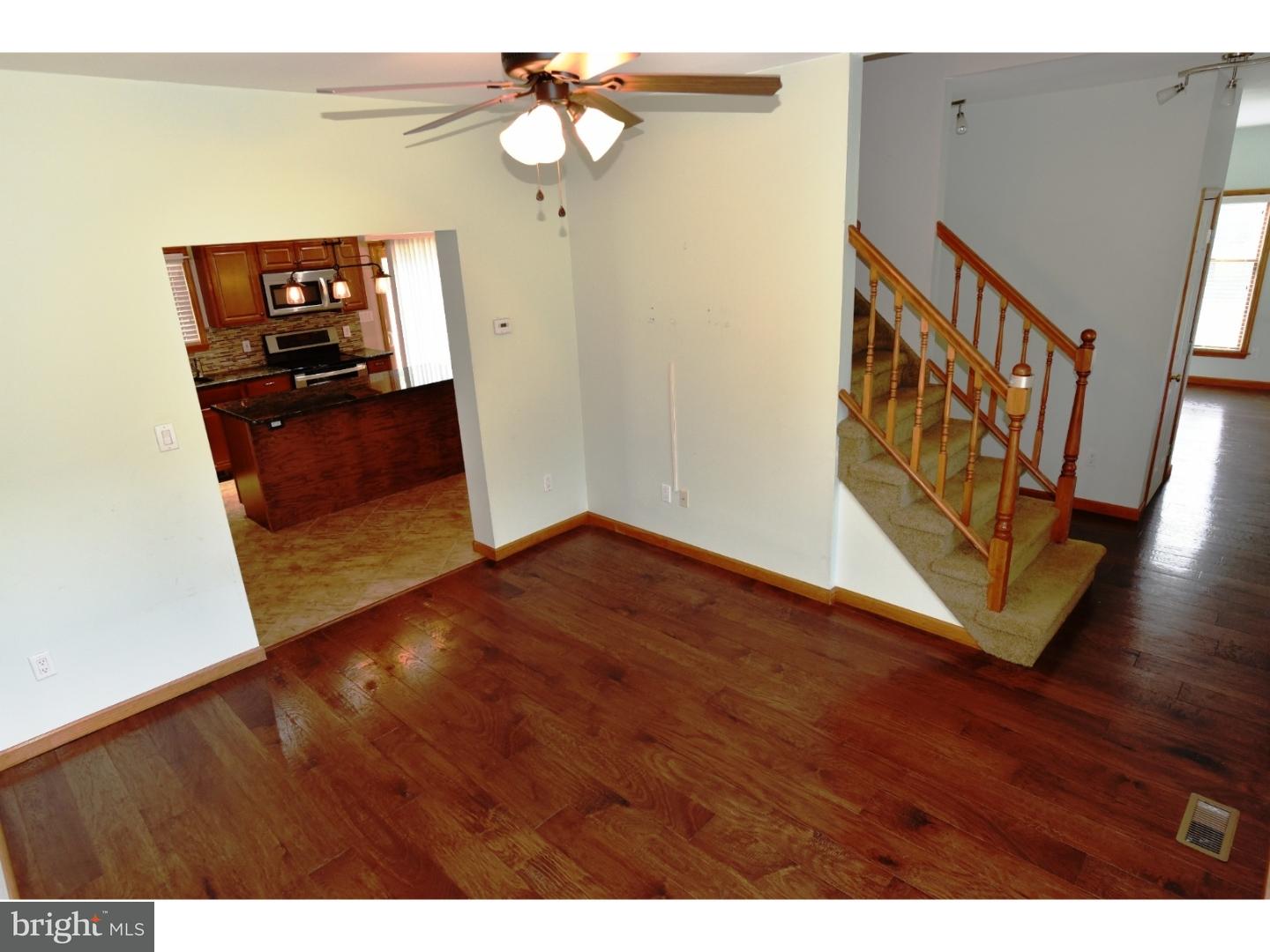 529 Province Line Road Allentown, NJ 08501 - Photo 8 of 21 a view of a hallway with wooden floor and staircase