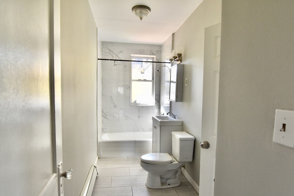 103 Homestead Street, Unit 1 Boston, MA 02121 - Photo 13 of 16 a bathroom with a toilet and a shower