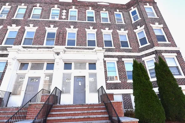 a front view of a multi story residential apartment building