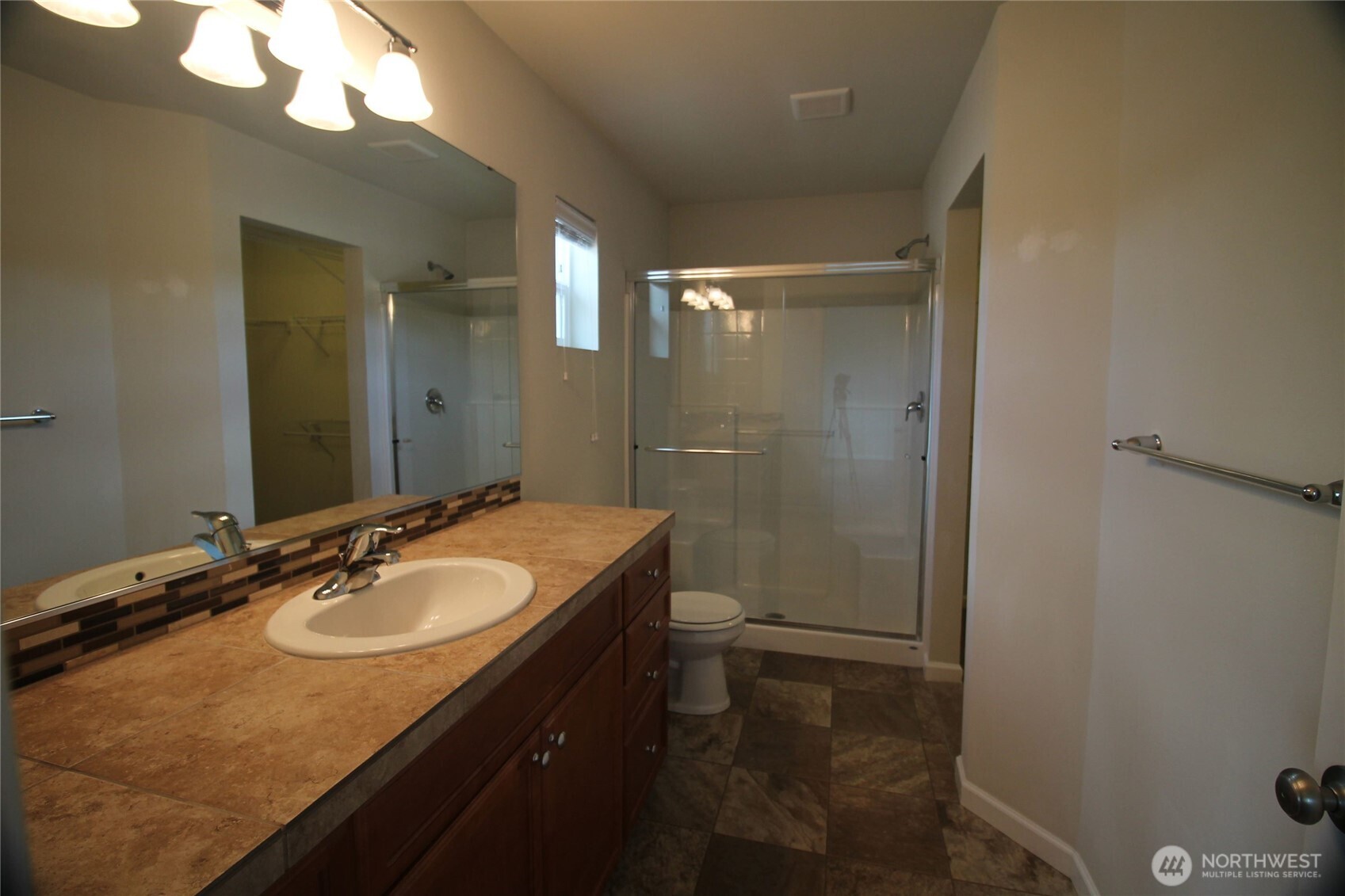 3721 202nd Pl S East Bothell, WA 98012 - Photo 12 of 23 a bathroom with a granite countertop sink toilet and shower