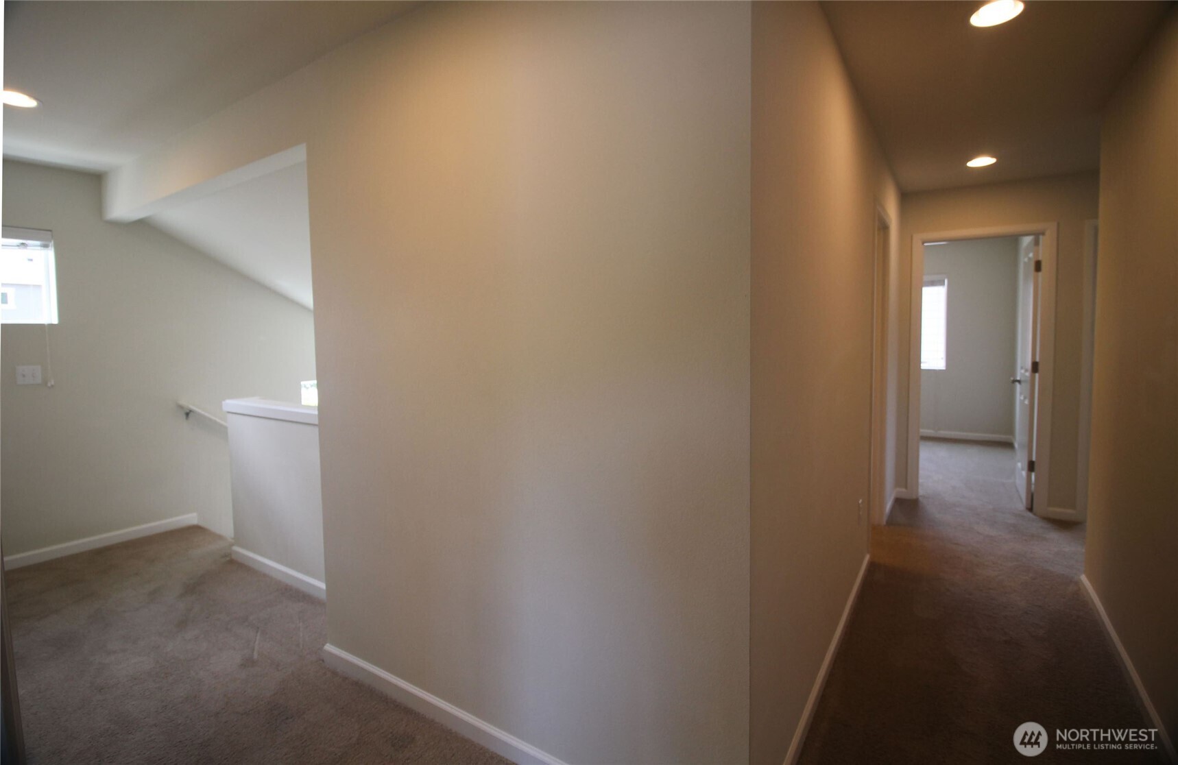 3721 202nd Pl S East Bothell, WA 98012 - Photo 9 of 23 a view of a hallway with wooden floor