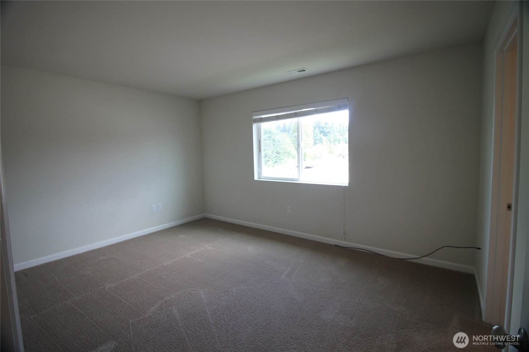 3721 202nd Pl S East Bothell, WA 98012 - Photo 10 of 23 an empty room with a window