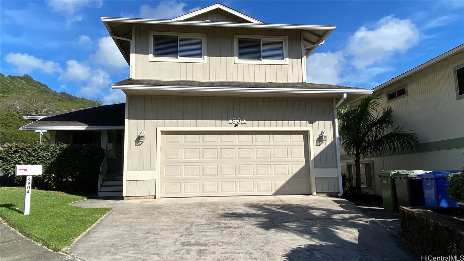 490 A Kuliouou Road Honolulu, HI 96821 - Photo 1 of 1 a front view of a house with a yard and garage