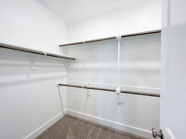 a view of an empty walk in closet