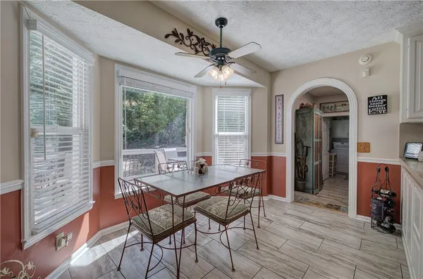 a view of a dining room with furniture window and outside view