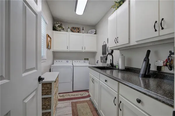 a kitchen with a sink and cabinets