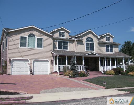 4 Putnam Road Howell, NJ 07731 - Photo 1 of 10 a front view of a house with yard