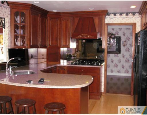 4 Putnam Road Howell, NJ 07731 - Photo 5 of 10 a kitchen with a sink and cabinets