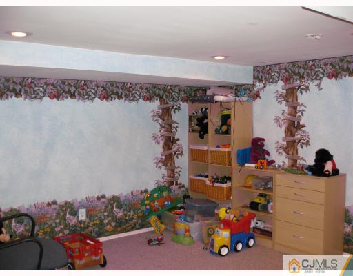 4 Putnam Road Howell, NJ 07731 - Photo 8 of 10 a view of a room with lots of different kinds of flowers