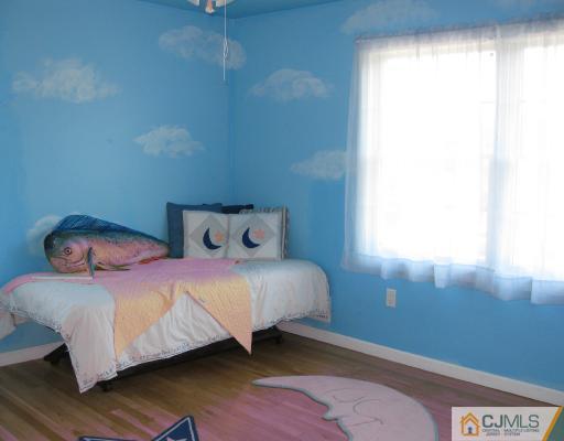 4 Putnam Road Howell, NJ 07731 - Photo 9 of 10 a bedroom with a bed and window