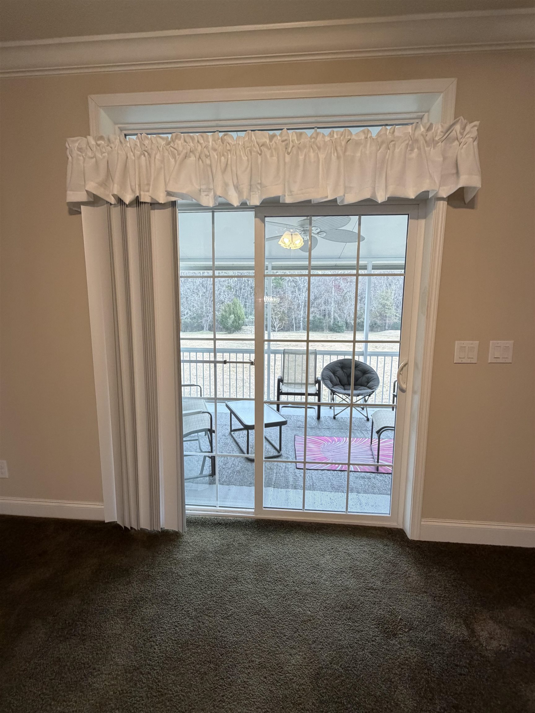 2434 Pellicer Road St. Augustine, FL 32092 - Photo 18 of 41 Empty room featuring dark colored carpet, healthy amount of natural light, and ornamental molding