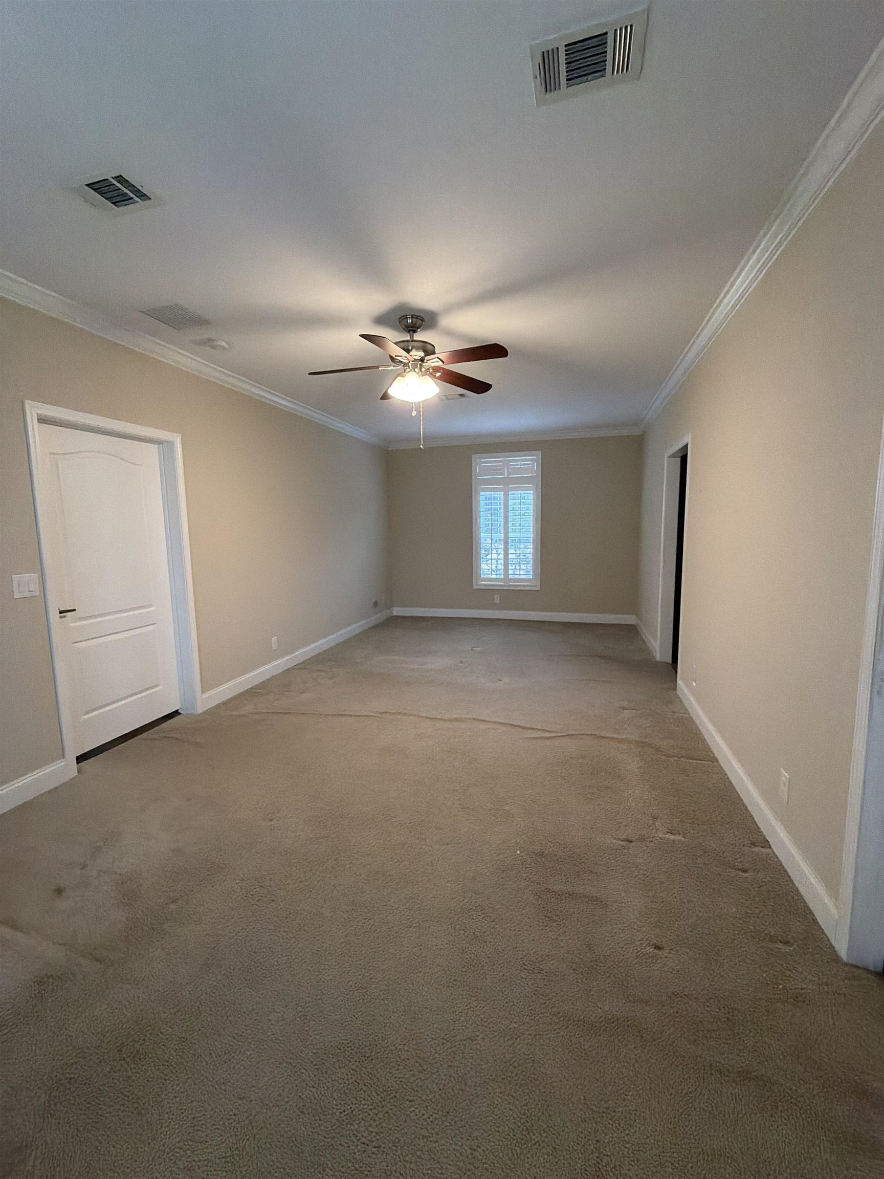 2434 Pellicer Road St. Augustine, FL 32092 - Photo 22 of 41 Carpeted empty room with ornamental molding and a ceiling fan