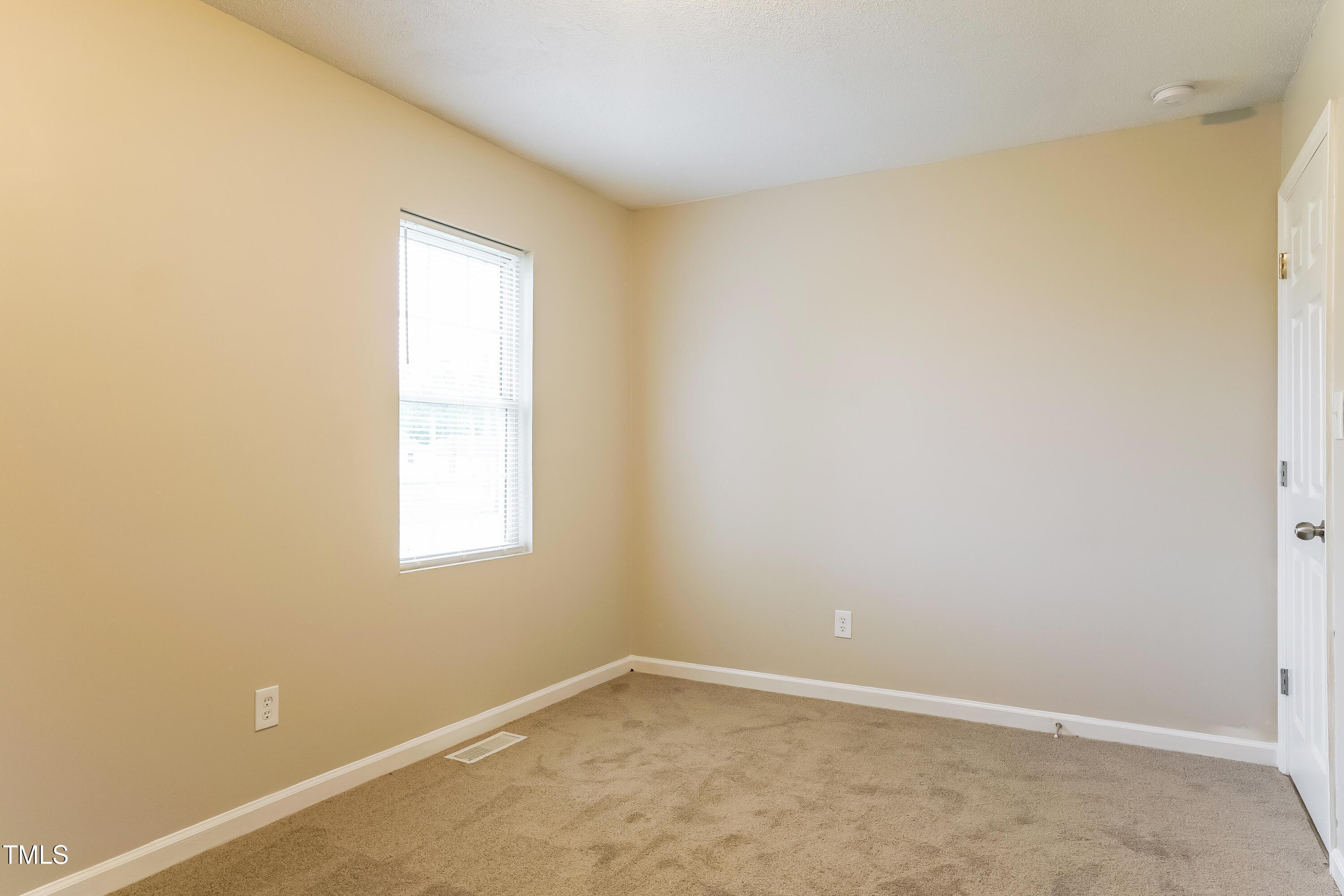 939 Rand Street Smithfield, NC 27577 - Photo 13 of 16 an empty room with a window
