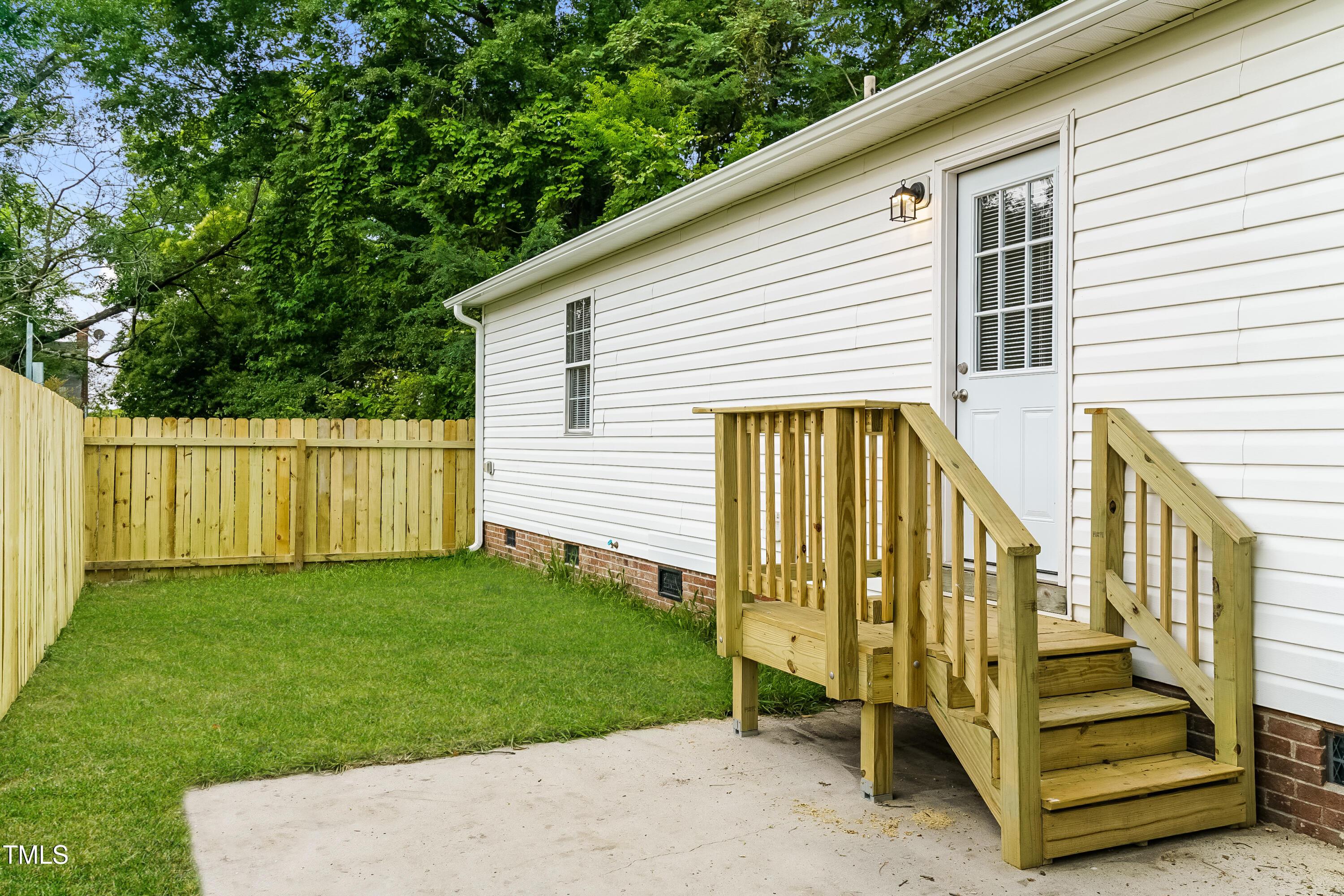 939 Rand Street Smithfield, NC 27577 - Photo 16 of 16 a view of a house with a small yard