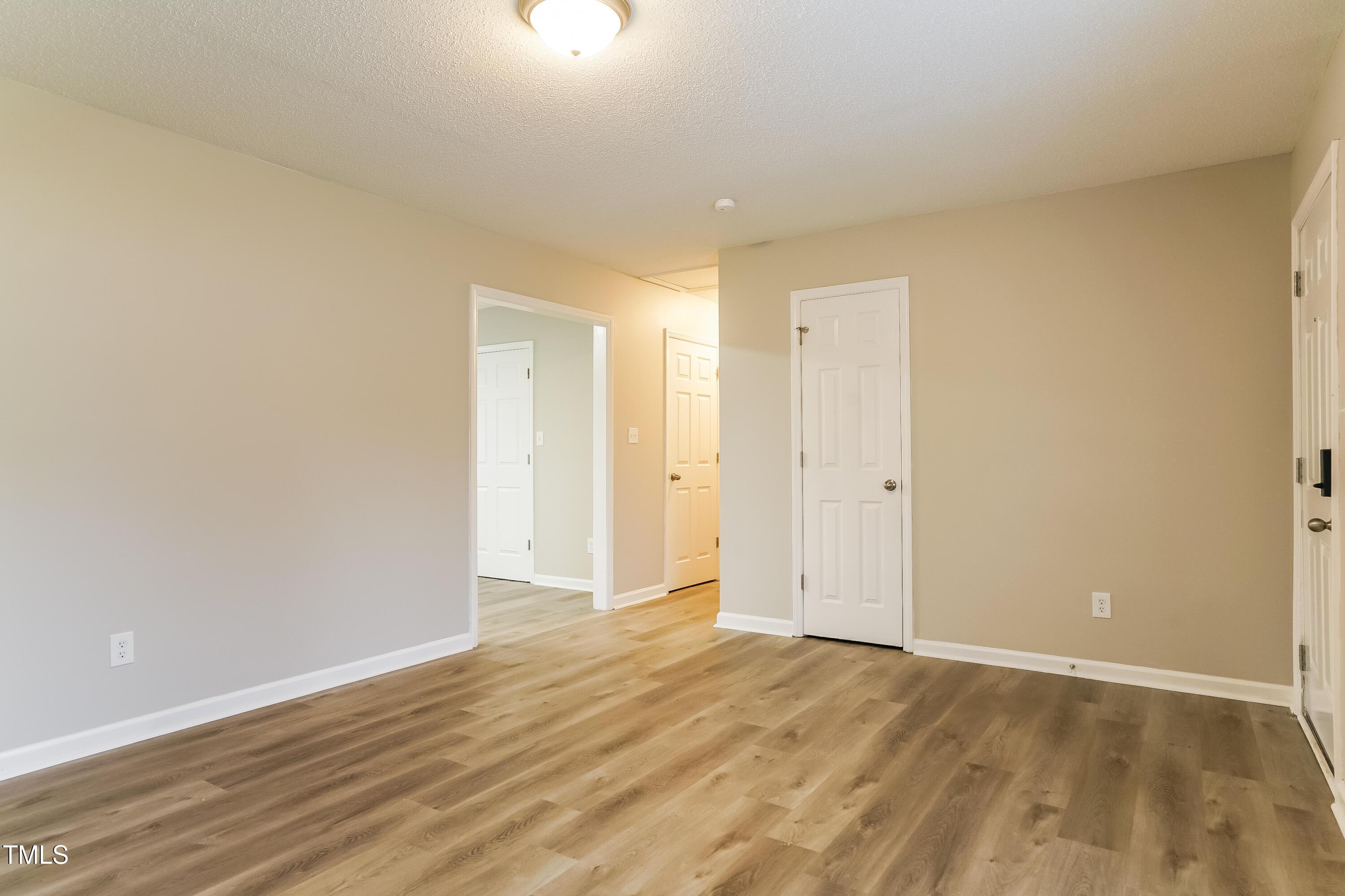 939 Rand Street Smithfield, NC 27577 - Photo 4 of 16 a view of an empty room and wooden floor