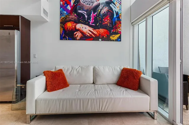 a bedroom with a large bed and a couch