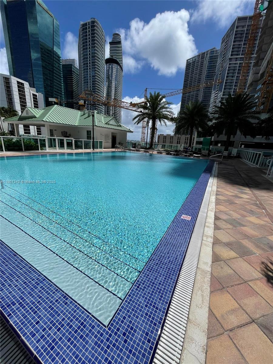 41 Southeast 5th Street, Unit 2008 Miami, FL 33131 - Photo 54 of 54 a view of a swimming pool with outdoor seating