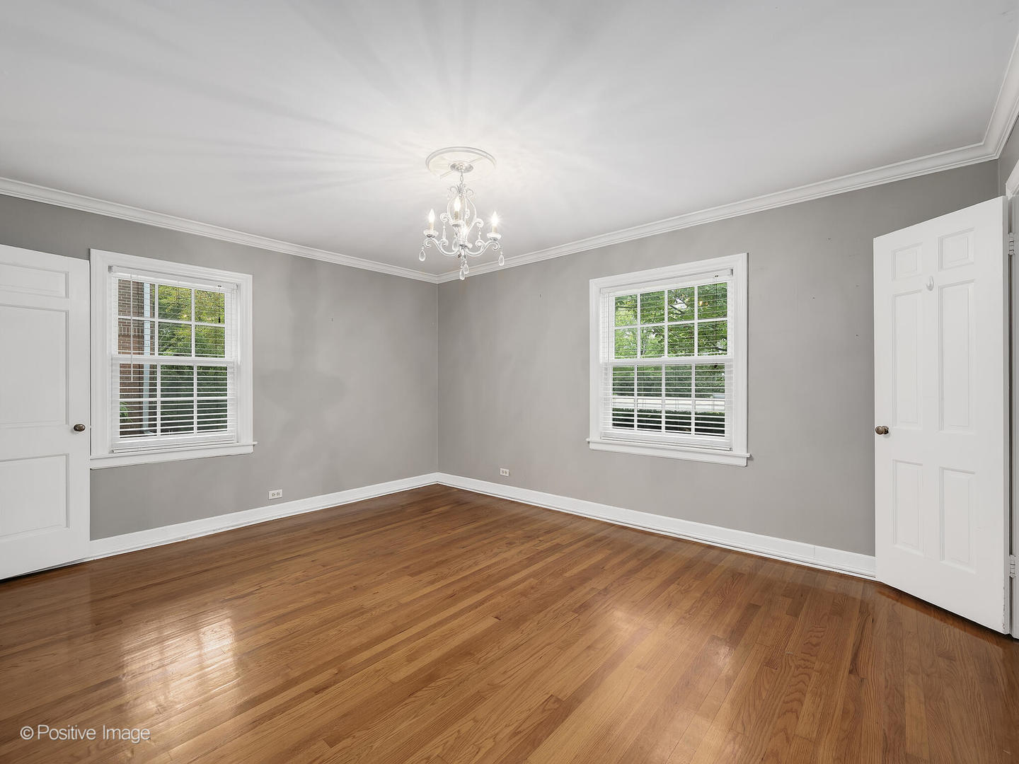 337 Wagner Road Northfield, IL 60093 - Photo 13 of 22 a view of an empty room with wooden floor and a window
