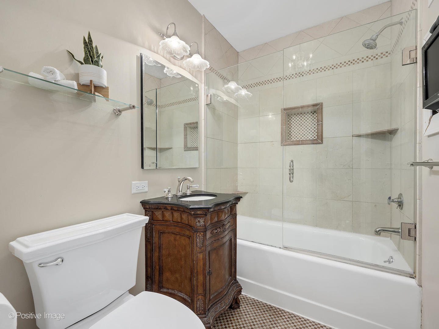 337 Wagner Road Northfield, IL 60093 - Photo 14 of 22 a bathroom with a granite countertop sink toilet and shower