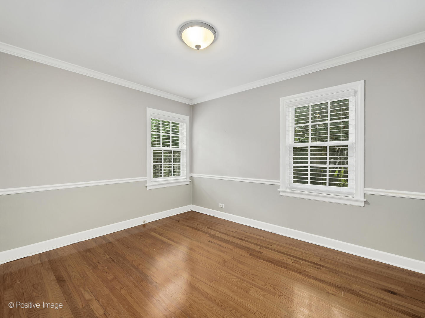 337 Wagner Road Northfield, IL 60093 - Photo 15 of 22 a view of an empty room with wooden floor and a window