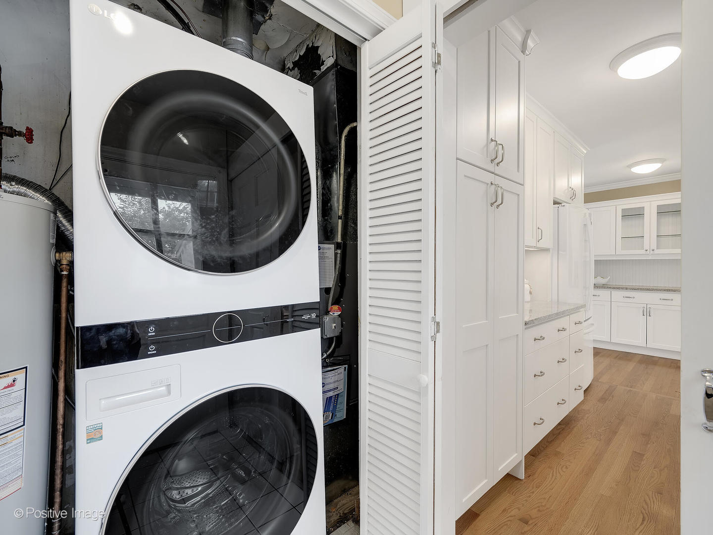337 Wagner Road Northfield, IL 60093 - Photo 17 of 22 a view of a hallway with washer and dryer